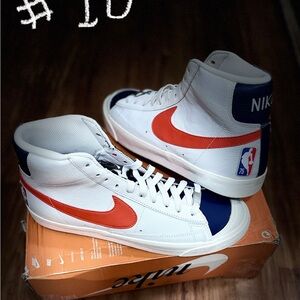 Nike White High-Top Sneakers with Orange Swoosh and Navy Accents